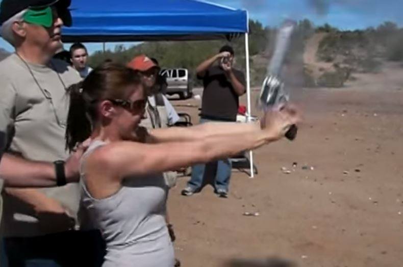The exact moment when an inexperienced shooter accidentally fires a .500 S&W magnum into the air.  These kind of powerful firearms and fully automatic weapons should NEVER be handed to an inexperienced shooter without sensible familiarization and safety precautions. Doing so courts disaster. 