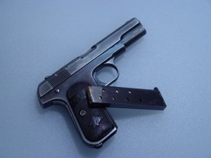 1903 Colt hammerless with a gold bead front sight that's still pretty much useless.