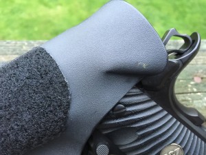This kink in the sweat guard will actually re-engage the manual safety of the 1911 as you holster the pistol if you forgot to do so yourself. I like this feature. A. LOT.