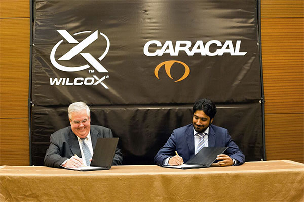 Caracal CEO Hamad Al Ameri and Wilcox Industries CEO Jim Teetzel endorse their new strategic partnership.